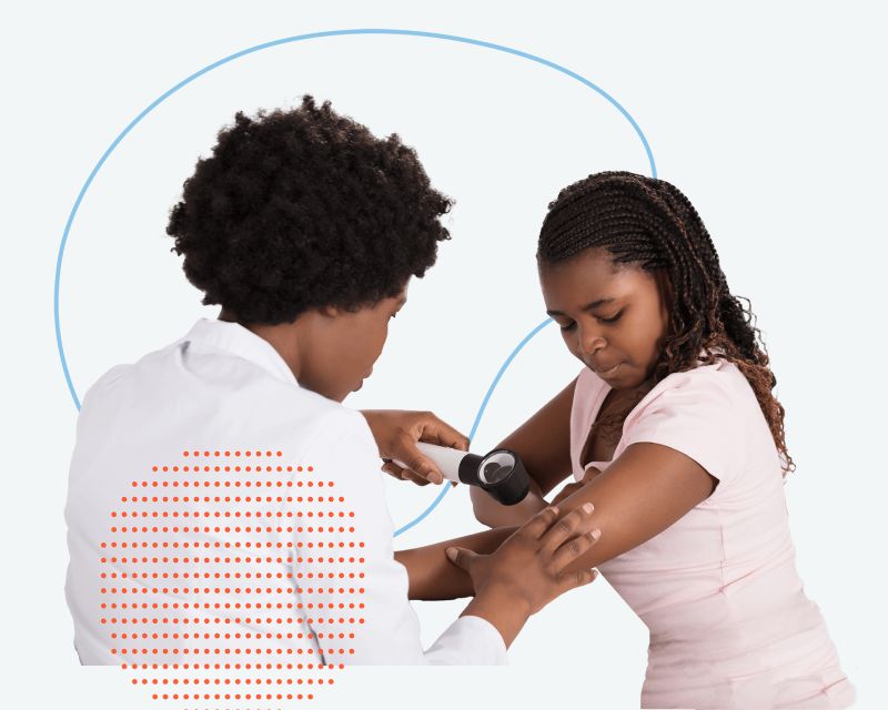 Provider examining girl's skin